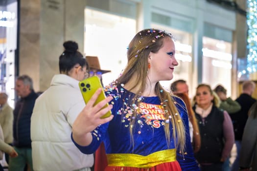 The image shows a person, presumably at an event or a public place, dressed in a costume that appears to be inspired by the iconic outfit of Snow White, with a modern twist as indicated by the text on the front that reads Super