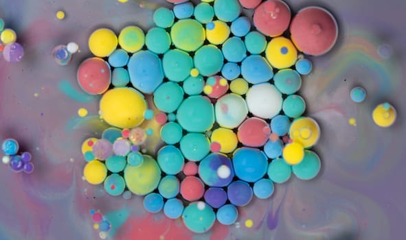 A Symphony of Spheres in Lavender HA close-up shot of vibrant, colorful spheres suspended in a lavender liquid, creating a mesmerizing abstract pattern.ues. High quality photo