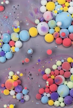 A Symphony of Spheres in Lavender HA close-up shot of vibrant, colorful spheres suspended in a lavender liquid, creating a mesmerizing abstract pattern.ues. High quality photo