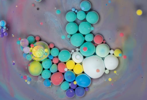 This artwork features a captivating arrangement of colorful bubbles in different sizes, blending various shades under soft light, creating an enchanting, abstract display.