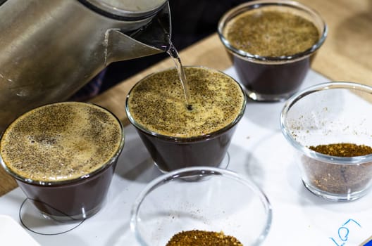 Professional barista testing the taste of a new coffee