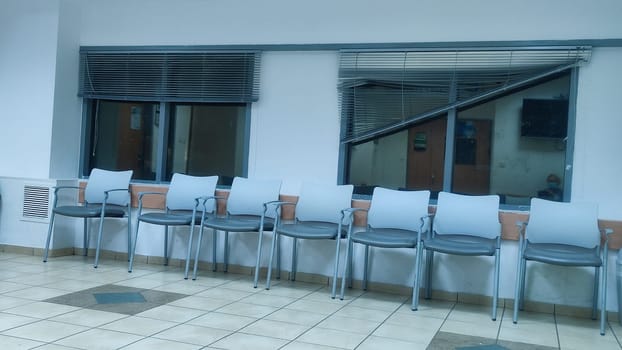 office space, room with windows, chairs along, objects. High quality photo