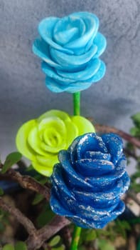 green blue rose, artificial flowers on a stick, crafts, homemade object souvenir gift decoration. High quality photo