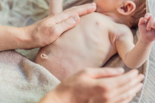 The newborn's skin is peeling. Mom uses skin products and massages to care for and soothe the baby's delicate skin, ensuring comfort and promoting healthy skin.