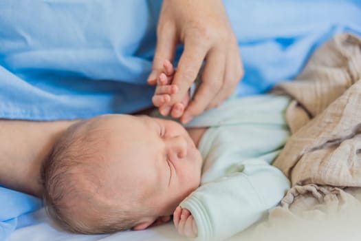 A baby lies with the mother after childbirth, resting peacefully. The serene moment captures the bond between mother and child as they begin their journey together. The hospital environment ensures a safe and comforting space for this intimate interaction.