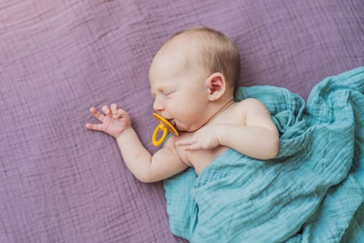 The baby is sleeping peacefully in his cozy nest. Newborn photo session captures the serene innocence and warmth of early moments.
