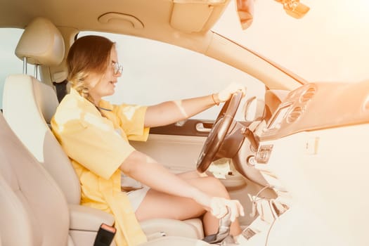 Relaxed business woman talking on video call on phone in automobile. Rested female professional saying bye on video chat in business car. Beautiful lady making video message in luxury car.