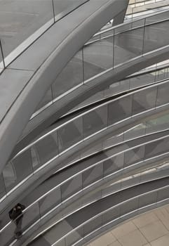 Berlin, Germany - Dec 20, 2023 - A curved walkway stretches in spirals upwards on top inside the glass dome constructed of the Reichstag building. Contemporary architecture of the Cupola of the Reichstag dome, a major tourist attraction of the berlin city, Space for text, Selective focus.