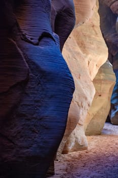The vivid contrast of colors within the narrow walls of Buckskin Gulch Slot Canyon on the Arizona, Utah border. The light hitting the rock completely changes the color of this natural rock formation.