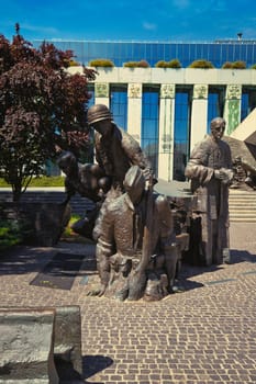 A detailed view of the Warsaw Uprising Monument, commemorating the brave Polish resistance fighters of the 1944 Warsaw Uprising during World War II. The bronze figures, captured in a moment of action, depict soldiers and civilians working together in their fight for freedom. The monument, located near the Uprising Museum, is a powerful symbol of Poland history and resilience. Ideal for themes related to history, war memorials, and Polish culture