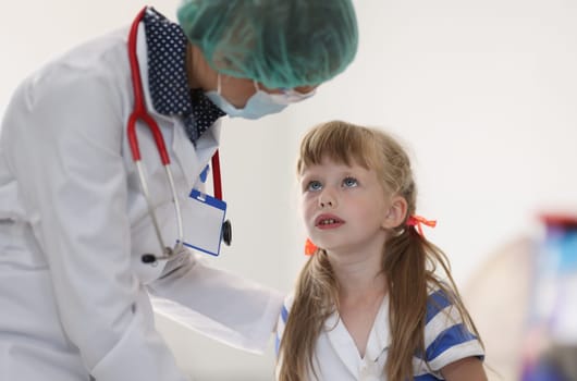 Portrait of little girl at doctor's appointment. Pediatrics in medical centers and clinics concept