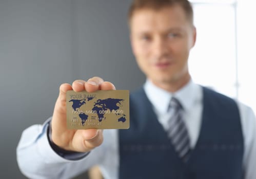 Businessman holds credit bank card. Banking and service concept