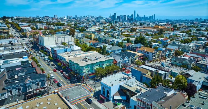 Image of Aerial Castro District rainbow crosswalks with skyscraper view of downtown San Francisco