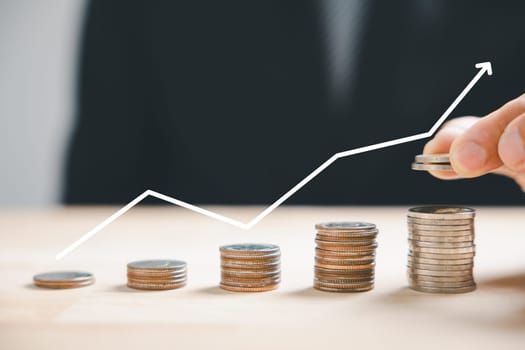 Financial investment blooms as silver coins form a stack near a trading chart up arrow, capturing the essence of stock growth. Technology rapid leaps drive this evolution. money saving graph