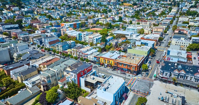 Image of Aerial over San Francisco Castro District with LGBTQIA+ crosswalks with people and city