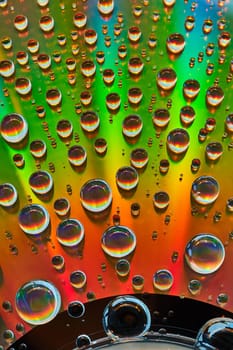 Image of Abstract background asset metallic surface of rainbow colors with water droplets