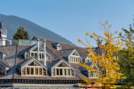 Attic residential units windows on autumn season in Whistler, British Columbia.