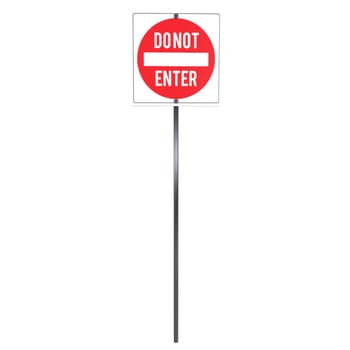 A tall red and white do not enter sign on a black pole indicates restricted access.