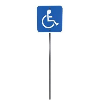 A disabled parking sign is shown on a metal pole, indicating accessibility.