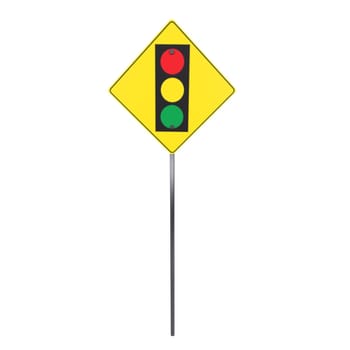 A traffic signal displayed on a yellow warning sign stands on a pole.