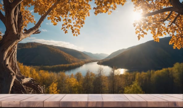 A wooden platform or table sits at the bottom of the image. The background is a beautiful scene of a river flowing between rolling hills in a forest. The hills are covered in trees with yellow leaves. A tree with a large trunk and many branches with yellow leaves hangs over the view, partially blocking the sun.