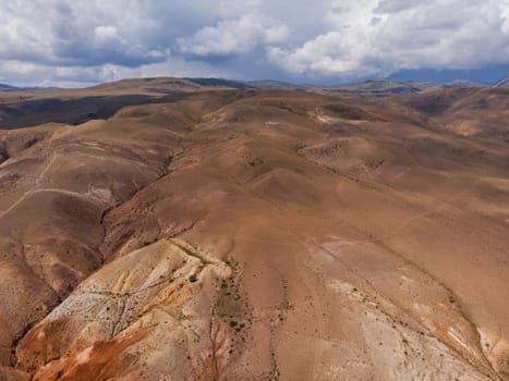Aerial drone view of colorful eroded landform of Altai mountains in popular tourist location called Mars, Chagan-Uzun, Altai Republic, Russia
