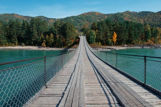 Bridge on the Katun river, Altai Republic, Russia, autumn sunny day