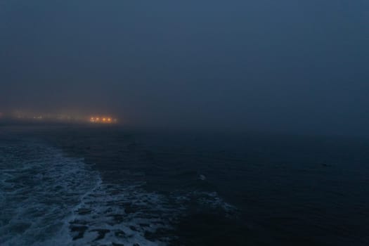 Foggy calm sea in the late evening. Mid shot