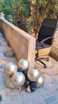 inflatable balloons on the ground, fence street objects. High quality photo