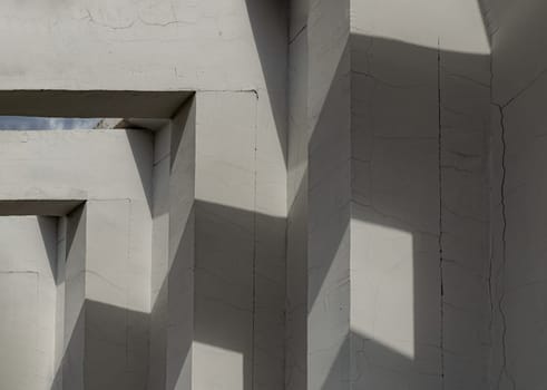 Sunlight shines through of Cement columns of Minimalist architecture modernism. White concrete pillars the exterior of the building, Copy space, Selective Focus.