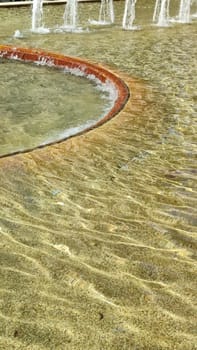 yellow color abstract background, texture water fountains, fountain pool. High quality photo