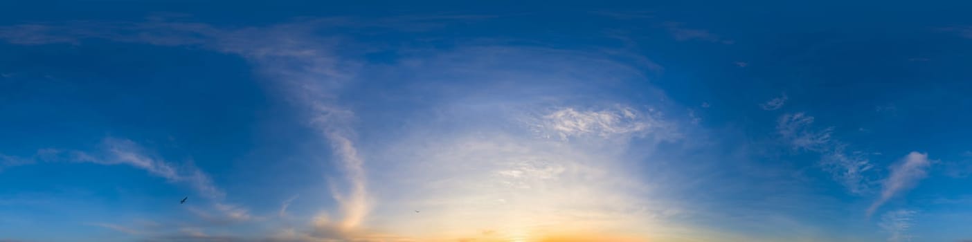 360 panorama of glowing sunset sky with bright Cirrus clouds. Seamless hdr spherical 360 panorama. Sky dome in 3D visualization, sky replacement for aerial drone panoramas. Weather and climate change.