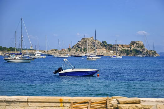 Port in the city of Kerkyra on the island of Corfu - Greece.
An old fortress with ships and a beautiful Mediterranean landscape.