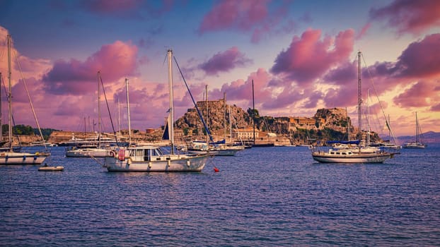 Port in the city of Kerkyra on the island of Corfu - Greece.
An old fortress with ships and a beautiful Mediterranean landscape.