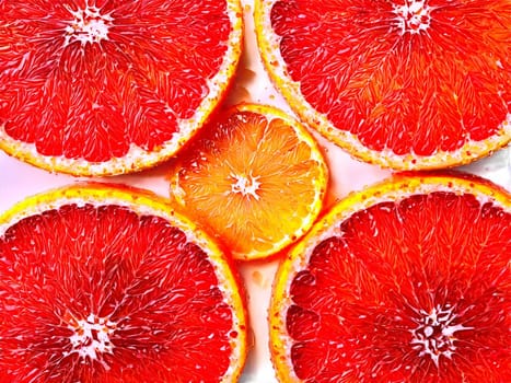 Grapefruit segmented and sprinkled with a pinch of sugar served on a transparent glass plate. Food isolated on transparent background.