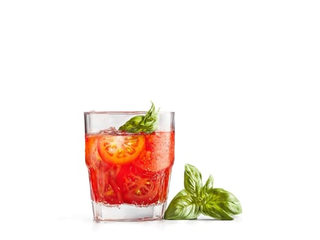 Tomato soda in a highball glass tomato slices and basil leaves vibrant red splash in. Drink isolated on transparent background.