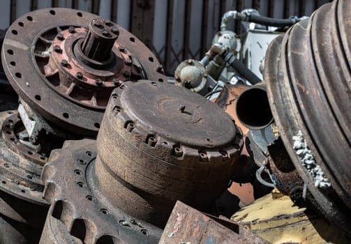 Old tractor parts, Rusty ndustrial machinery and other used at second hand parts car shop. Recycling, Space for text, Selective focus.