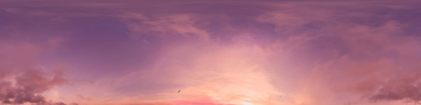Dramatic Sunset sky 360 panorama. Vibrant sky with bright glowing red pink Cumulus clouds. HDR 360 seamless spherical panorama. Sky dome for aerial drone panoramas. Climate and weather change