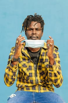 attractive young black man wearing a protective mask, lifestyle concept and virus protection