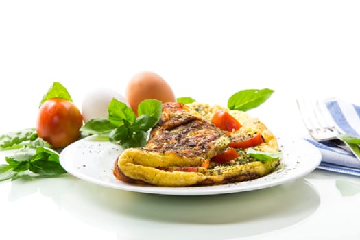 Stuffed omelette with tomatoes isolated on white background. Healthy diet food for breakfast.
