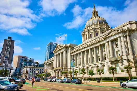 Image of City hall street view with blue sky overhead and puffy white clouds