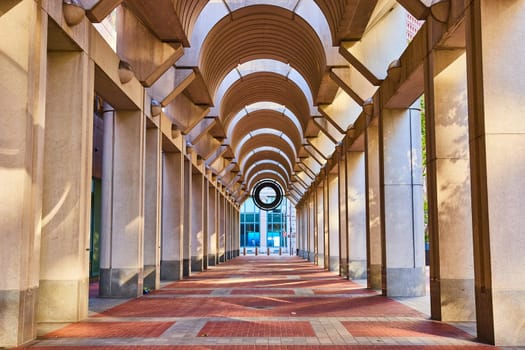 Image of Wide view of curved ceiling with patterned red and tan brick pattern on ground