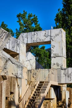 Image of Lone seagull stands atop corner piece of Vaillancourt Fountain with stairs leading to landing