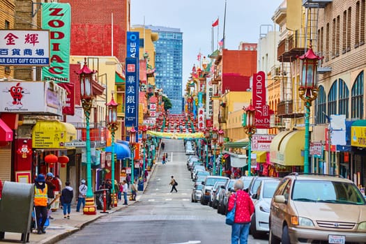 Image of Vibrant Chinatown view of buildings with hanging lanterns and tons of signs