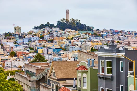 Image of Overcast day aerial close up of houses leading back to distant Coit Tower