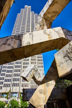 Image of Interlocking Vaillancourt Fountain sculpture with textured concrete blocks in front of skyscraper