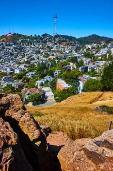 Image of Corona Heights view of city with Sutro Tower on distant hill on pretty blue sky day