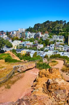 Image of Corona Heights park trail leading down to neighborhood of houses on hill