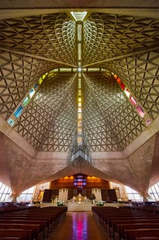 Image of Aisle view with pews and altar with ceiling view of Cathedral of Saint Mary of the Assumption