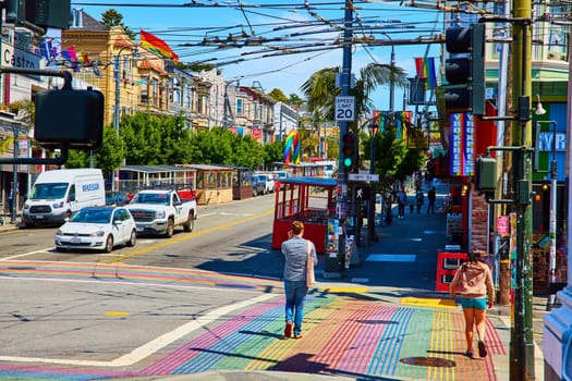 Image of People walking on rainbow sidewalks toward Gyro Xpress in Castro District